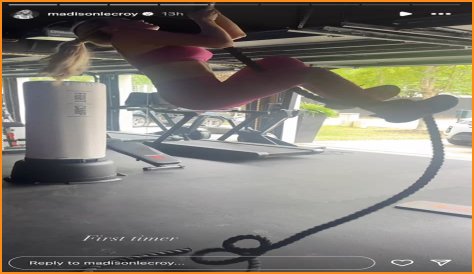 Madison LeCroy in Two-Piece Workout Gear Climbs a Rope as a 